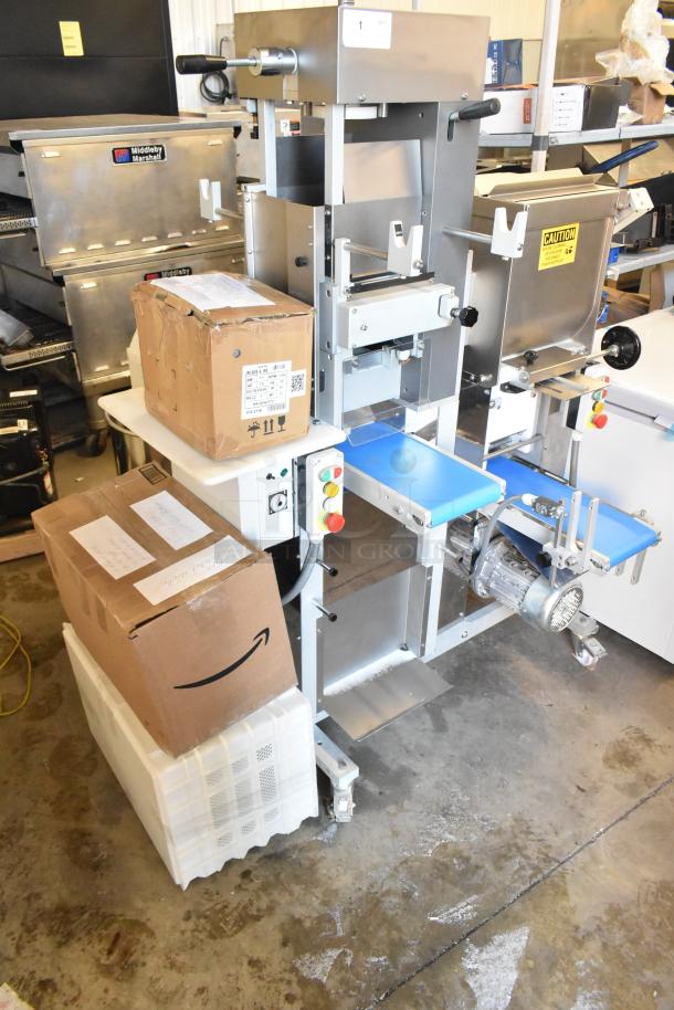 Arcobaleno AMF160 Pasta Machine with lasagna cutter, pasta cutters, ravioli molds, rollers, and accessories on casters.