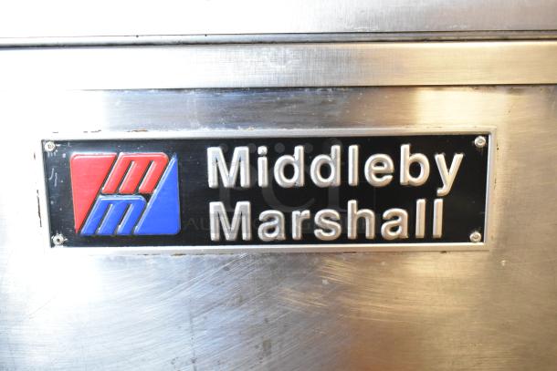 Stainless steel Middleby Marshall PS638G conveyor pizza ovens, 89,000 BTU, natural gas, on commercial casters, model label visible.