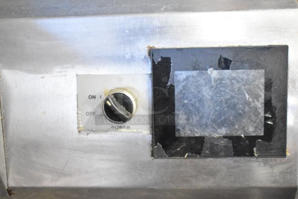 Close-up of the control panel on a Middleby Marshall PS638G pizza oven, showing a power switch and worn surfaces.