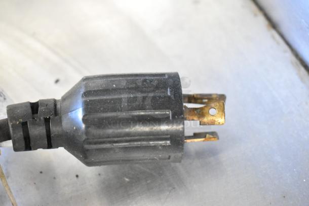 The image shows a close-up of a plug, not the Middleby Marshall PS638G pizza ovens.