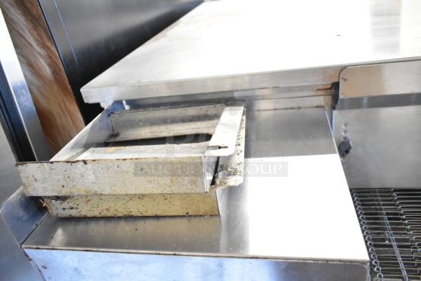 2 Middleby Marshall PS638G stainless steel conveyor pizza ovens, natural gas powered, on casters, 89,000 BTU, detailed view.