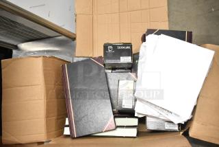 Lot of approx. 25 items, including notebooks, copy paper reams, and Lexmark printer cartridge in open cardboard box.
