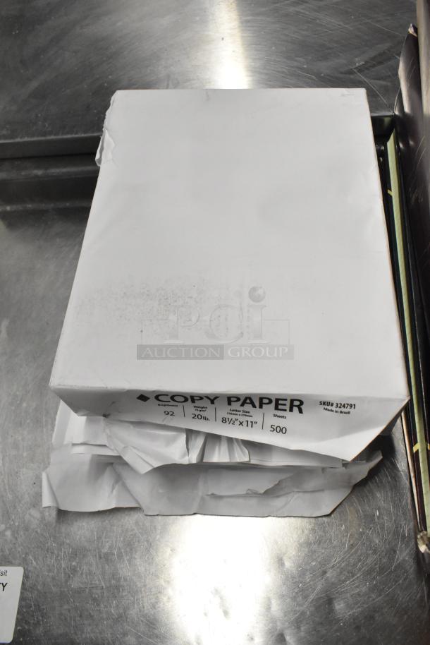 Lot of office supplies including copy paper ream with torn packaging, 92 brightness, 20 lb, 8.5x11 inches, 500 sheets.
