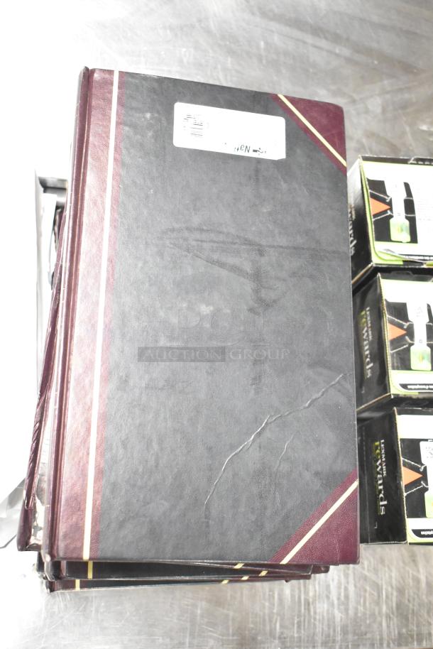 Lot of approximately 25 items including notebooks, reams of copy paper, and Lexmark printer cartridges. Good condition.