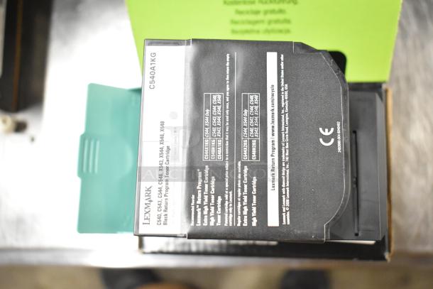 Lexmark printer cartridge, model C540A1KG, new in box with product specifications label, part of a 25-item lot.
