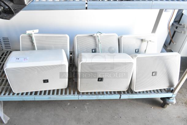 6 JBL Control 28-1-WH 8 Ohm speakers on shelf; white casings, JBL logo. Good condition, includes mounting brackets.