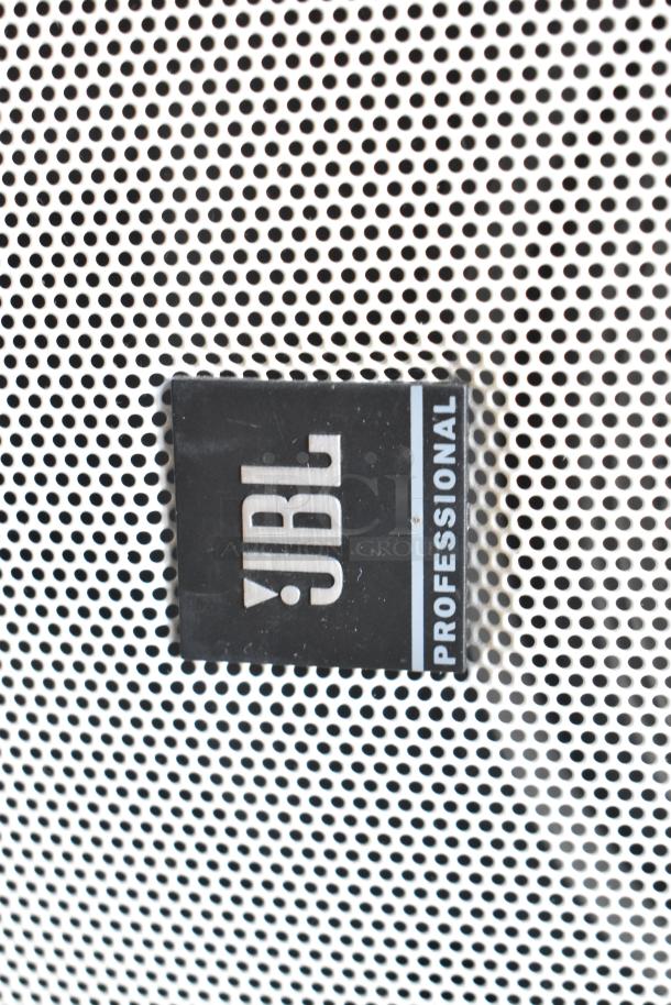 JBL Control 28-1-WH speaker close-up, featuring a perforated white grille and JBL Professional logo.