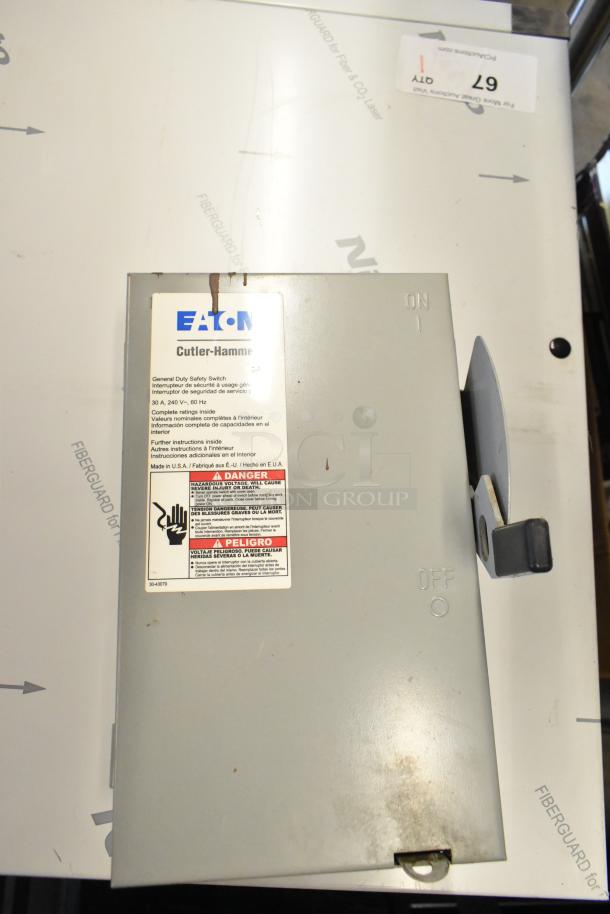 Eaton Cutler-Hammer power box with safety switch and warning labels. Slight wear visible, part of a 19-item auction lot.
