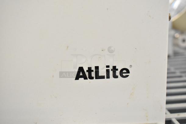 Set of 19 various items, featuring AtLite emergency lighting, an exit sign, and an Eaton power box, emphasizing safety features.
