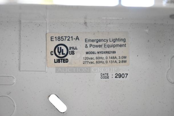 Alt text: UL-listed emergency lighting and power equipment label on model NYDXR62189, 120Vac, 277Vac, date code 2907.