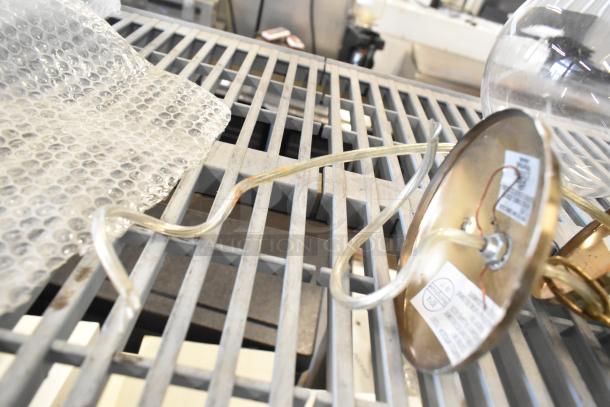 19-item auction lot with emergency lights, exit sign, Eaton power box. Includes labels and wires, sold together by bid.