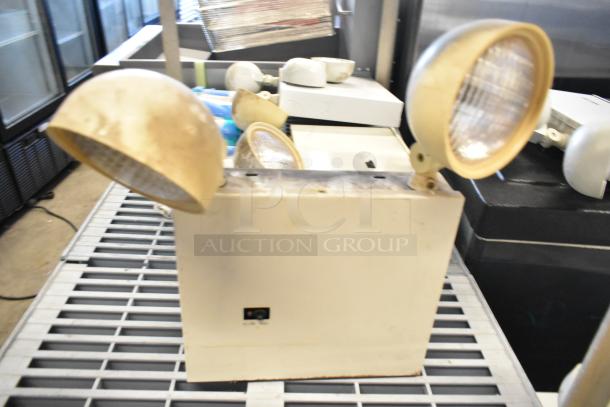 19 various items including emergency lights, exit sign, and Eaton power box. Mixed condition. Sold as-is, 19 times bid.