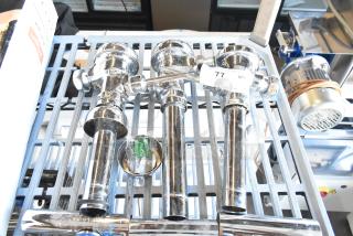 Three chrome flushing handles, new condition, with mounting hardware; tagged "77 Q7" on metal shelf.