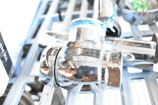 Chrome flushing handle with reflective finish, slight wear. Includes blue tie, suitable for plumbing fixtures.