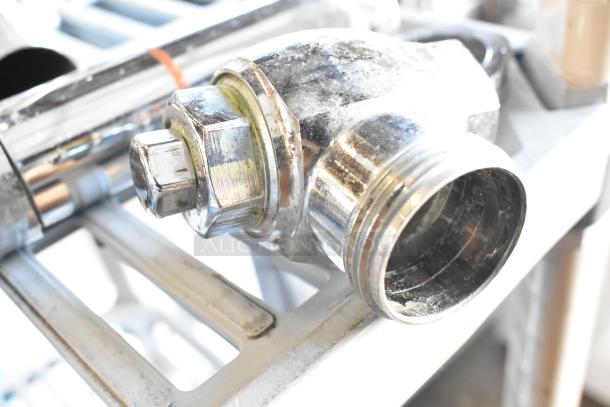 Chrome flushing handle with visible threading, moderate wear, and metal finish. Auction lot includes three handles.