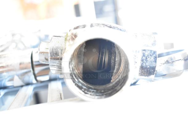 Three chrome flushing handles, close-up view, in excellent condition. Ideal for plumbing upgrades or repairs.