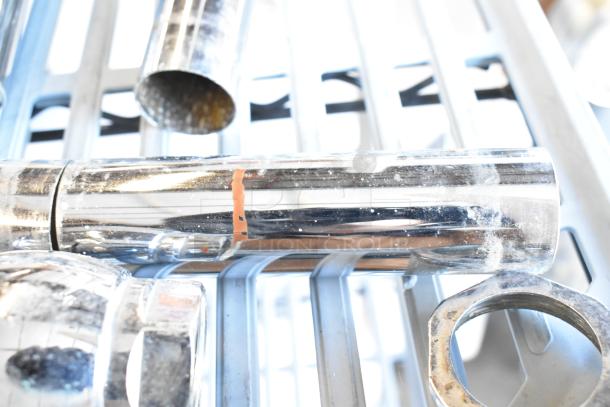 Three chrome flushing handles, slightly tarnished, with visible wear. Auction includes three handles per bid.