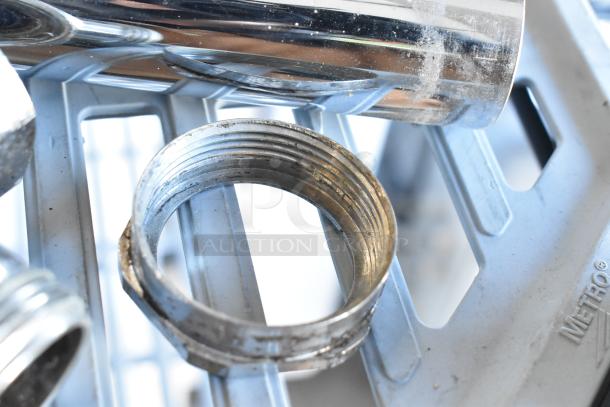 Chrome flushing handle with visible threading, moderate wear, and reflective finish, suitable for plumbing fixtures.