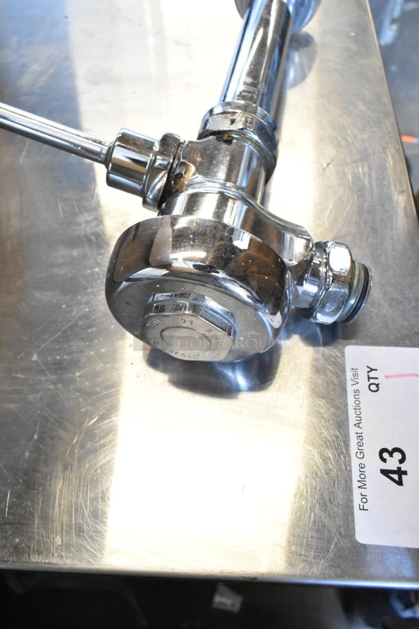 Chrome flushing handle with visible markings on metal, slight wear. Includes 3 items per bid. Auction tag reads "43".