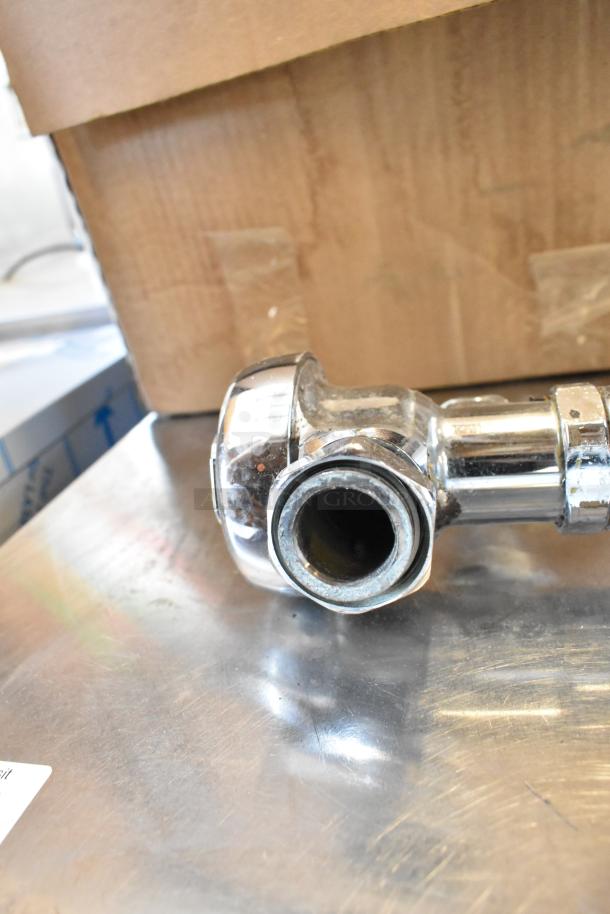 Chrome flushing handle, unused condition, sturdy metal construction, part of a set of three for auction.