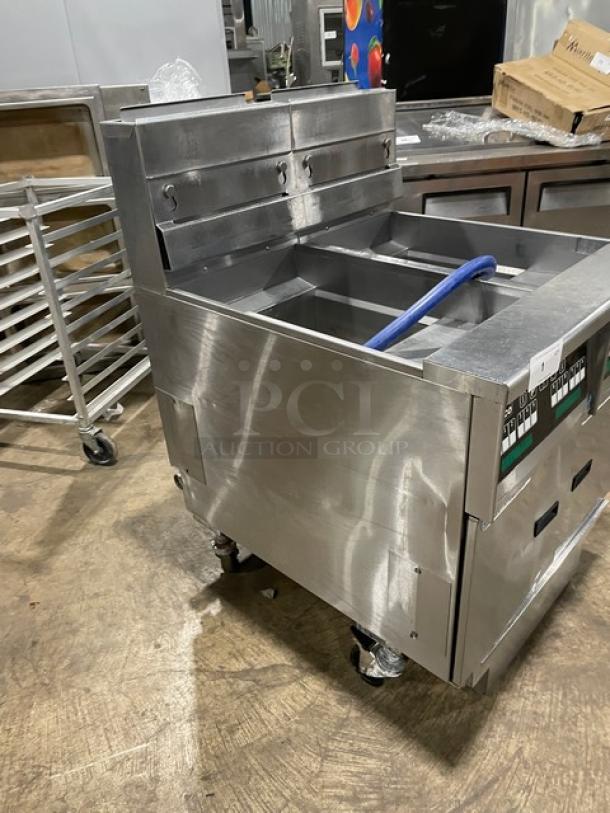 Pitco Solstice Supreme SSH55 2-bay 50lb deep fat fryer in stainless steel. Features backsplash, basket hanger, filtration system, on casters.