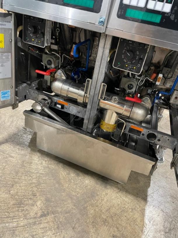 Pitco Solstice Supreme SSH55 commercial stainless steel 2-bay fryer with filtration system, basket hanger, and back splash.