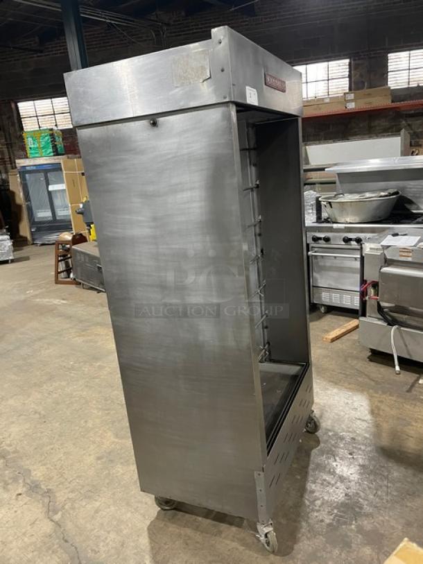 Attias commercial stainless steel rotisserie cabinet, gas-powered, full-height, on casters. Good condition.