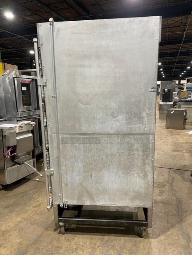 Attias commercial stainless steel gas-powered full-height rotisserie cabinet on casters, used condition.