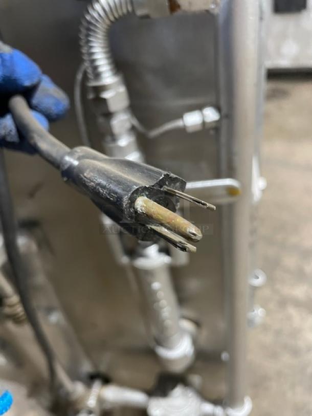 Attias stainless steel gas-powered rotisserie cabinet on casters, visible wear, detailed wiring, no tags or labels shown.