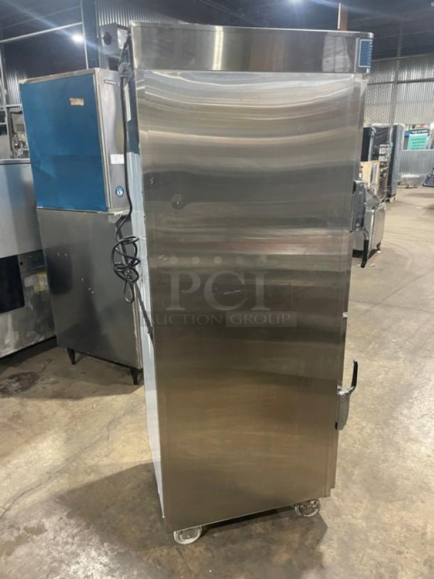 Alto-Shaam Halo Heat Series stainless steel electric Dutch door dual-compartment heated cabinet, Model 1200-UP/SR, on casters.