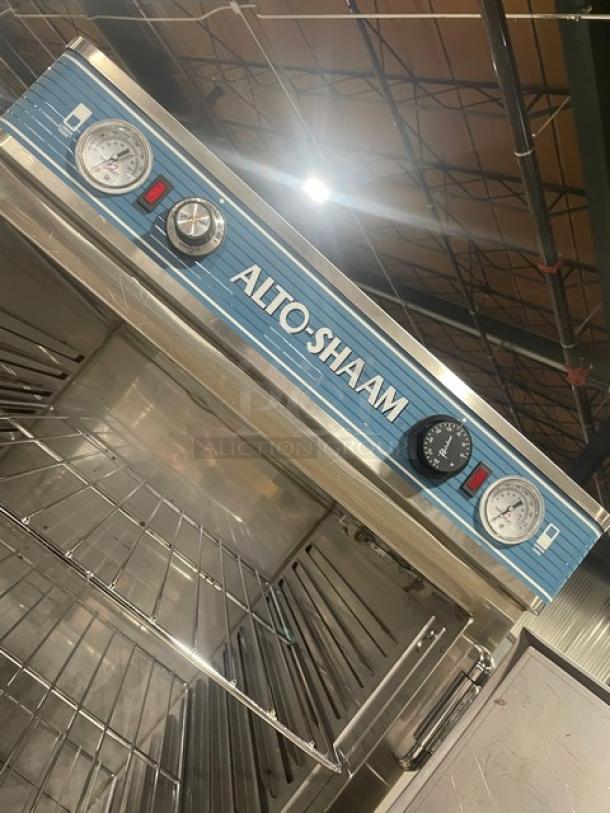 Alto-Shaam 1200-UP/SR stainless steel dual-compartment heated cabinet, chrome rack, dual controls, on casters.
