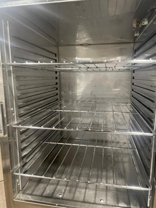 Alto-Shaam 1200UPSR heated cabinet interior, chrome-plated wired racks, stainless steel finish, used condition.