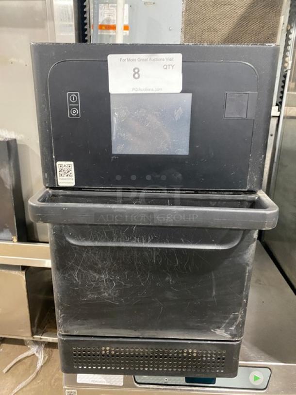 MerryChef black electric high-speed countertop rapid cook oven, model for commercial use, 208/240V, visible light wear.