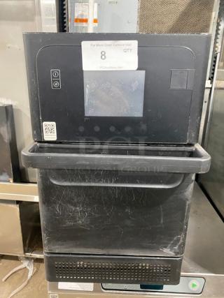 MerryChef black electric high-speed countertop rapid cook oven, model for commercial use, 208/240V, visible light wear.