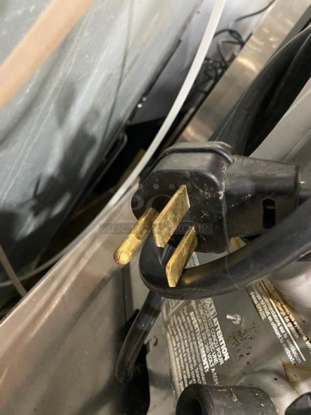 MerryChef commercial rapid cook oven, black, electric-powered, late model, 208/240V plug, minor wear, visible label.