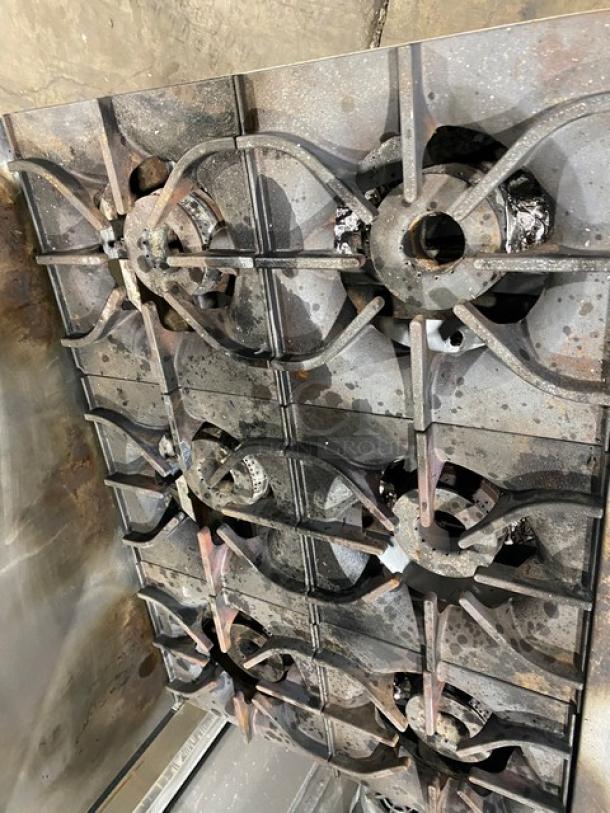 Asber commercial stainless steel 6-burner gas range/oven with backsplash, overhead salamander shelf, and wired oven rack.