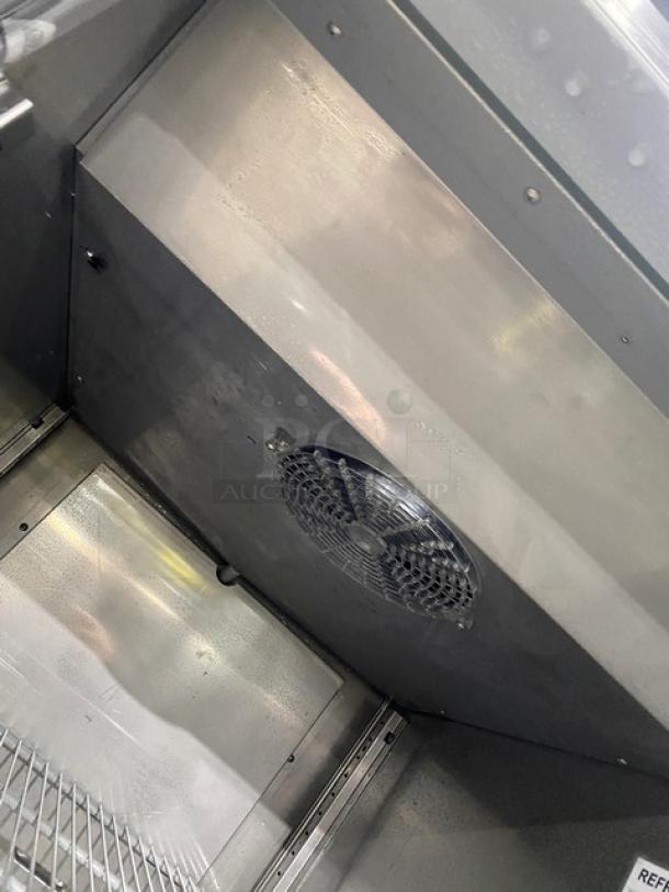 Hoshizaki CR1S-FGECR refrigerator interior, showing stainless steel finish with poly coated wired rack and fan vent.