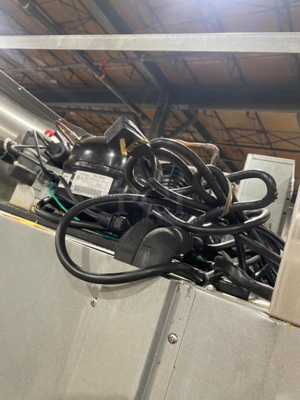 Hoshizaki stainless steel single glass door refrigerator, model CR1SFGECR, on casters with poly coated wired rack.