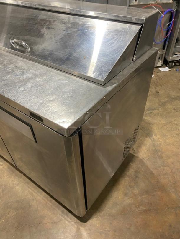 Turbo Air MST-48-N commercial stainless steel 2-door refrigerated prep table with poly coated rack, on casters.