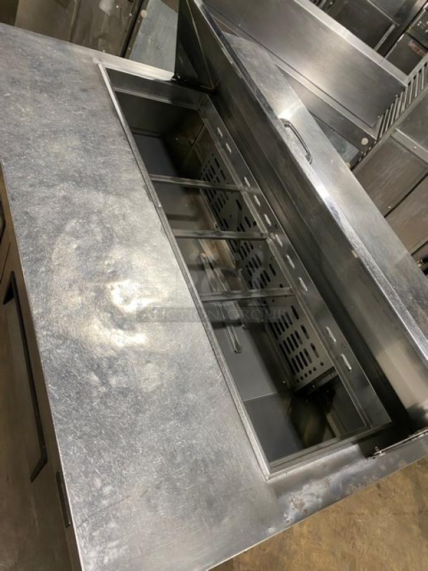 Turbo Air MST-48-N 2-door refrigerated prep table, stainless steel, with poly coated rack, on casters, 115V, good condition.