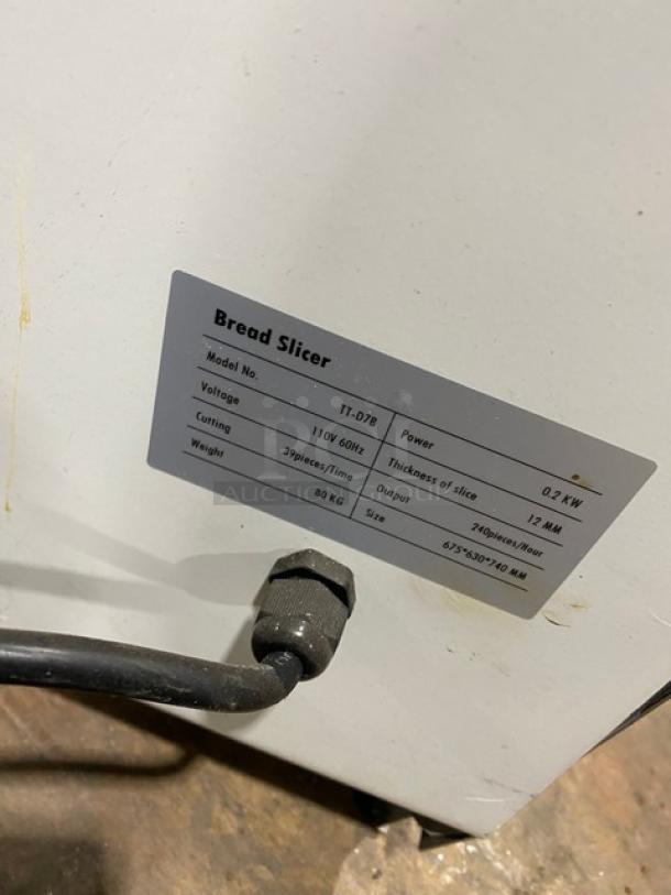 Twothousand TT-D7B bread slicer, white powder-coated stainless steel, 110V, 12MM slice thickness, in good condition.