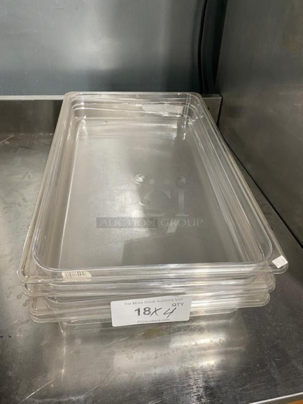 Cambro clear polycarbonate full-size food pan, 2.5" deep, new condition, stack of four, auction label visible.