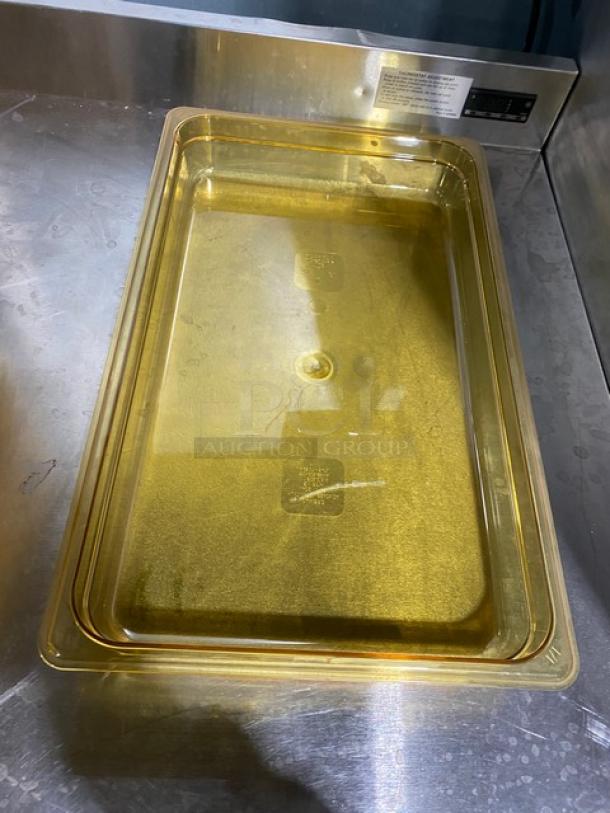 NEW Cambro commercial amber high-heat full-size 2.5" deep food pan on metal surface, unused and durable.