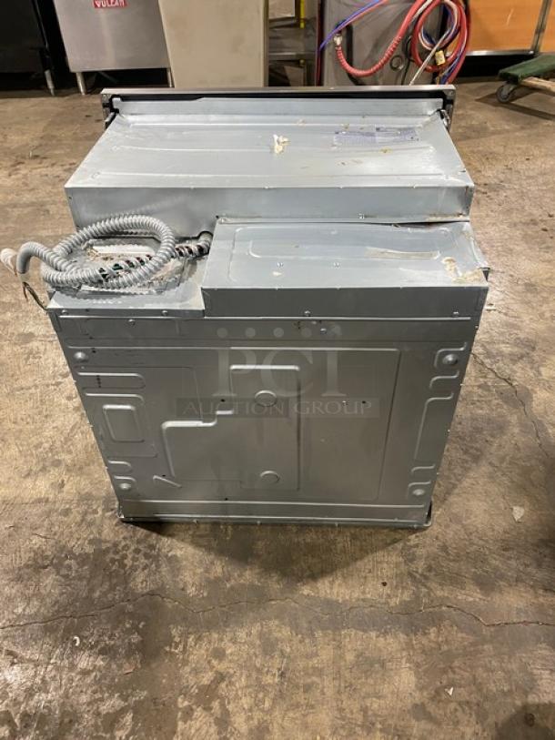 Samsung stainless steel electric wall oven, smart features, Flex-Duo divider, porcelain interior, wired rack, visible wear.