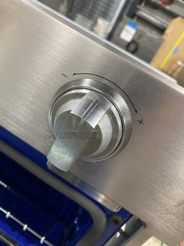 Samsung stainless steel smart oven with control knob, featuring Flex-Duo divider and blue porcelain interior.