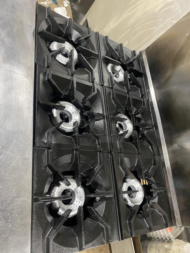 American Range commercial 6-burner stainless steel gas range and oven combo with backsplash, salamander shelf, and wired oven rack.