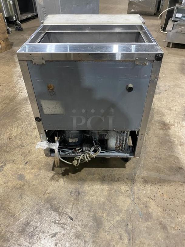 Turbo Air TST-28SD commercial stainless steel refrigerated prep table, single door, with cutting board, on casters, 115V.