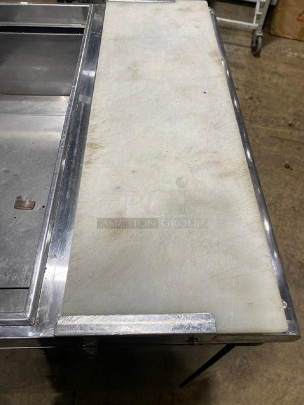 Turbo Air TST-28SD prep table with cutting board, stainless steel, single door, on casters, 115V, in used condition.