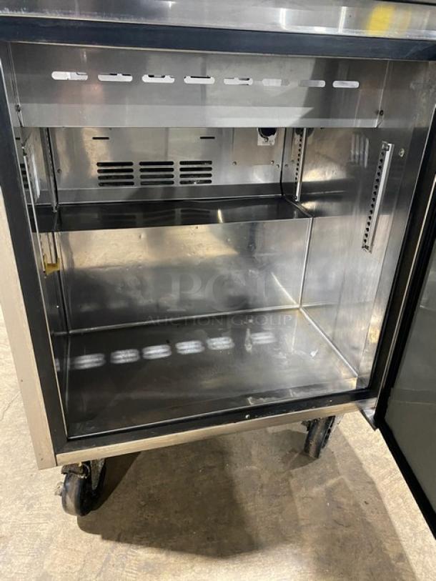 Turbo Air TST-28SD stainless steel refrigerated salad prep table, single door, 115V, with cutting board, on casters.