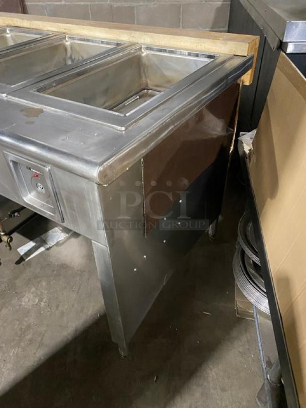 Wells commercial stainless steel 8-well steam table with individual controls and undershelf. In good condition, on sturdy legs.